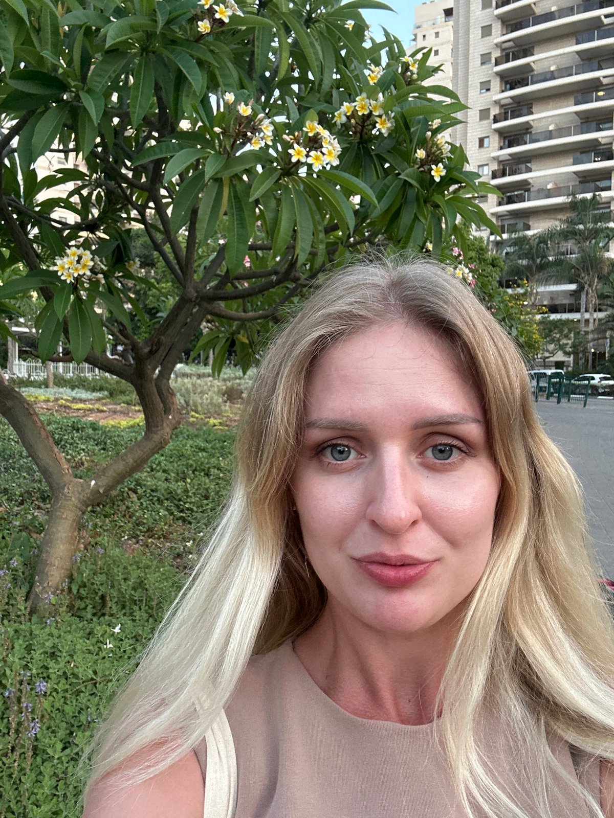 Selfie series on a Petah Tikva sidewalk, July 2026