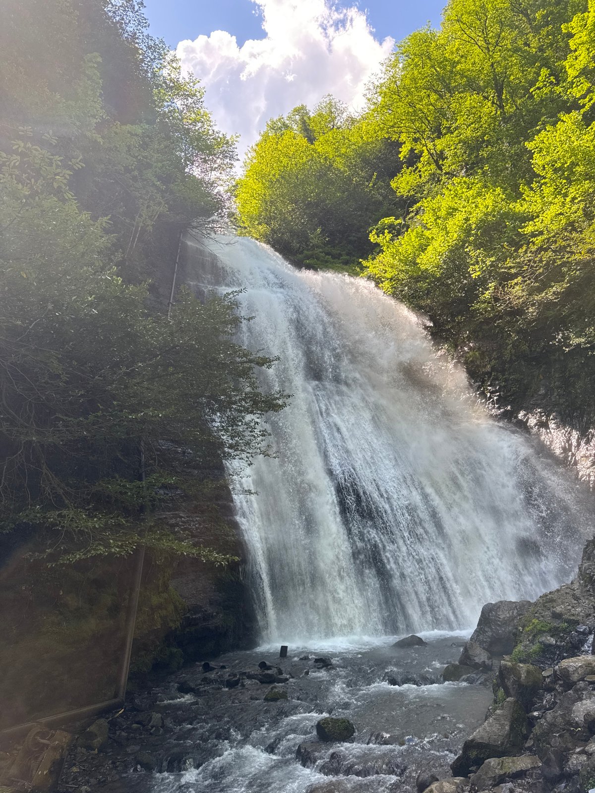 Visitors explore waterfall attraction in Tqwarchal, Abkhazia
