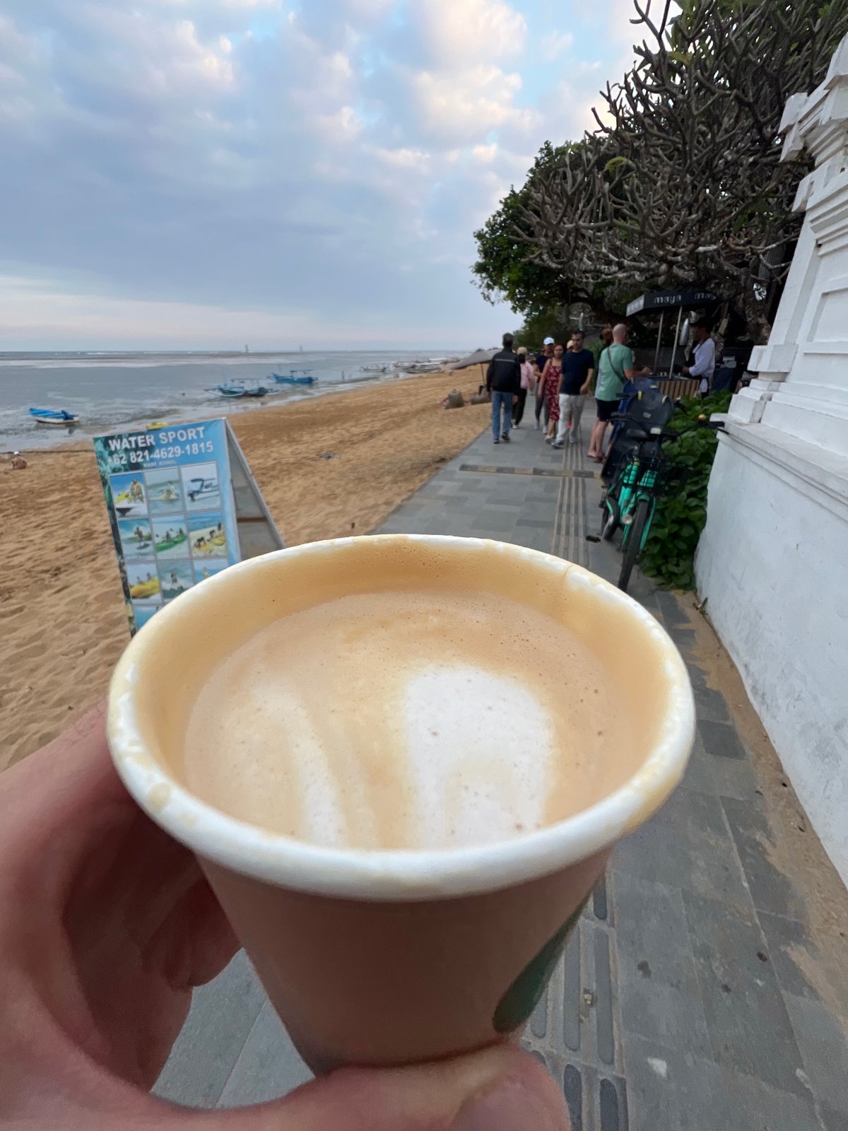 Low tide morning on Sanur Beach's busy promenade