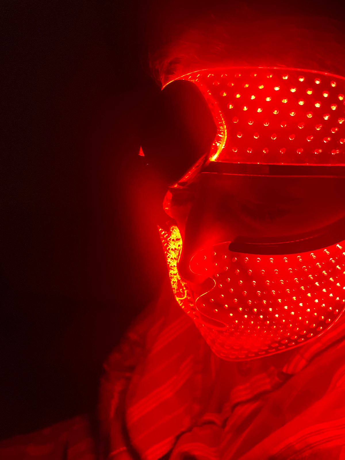 Person Uses Red LED Therapy Mask in Mexico