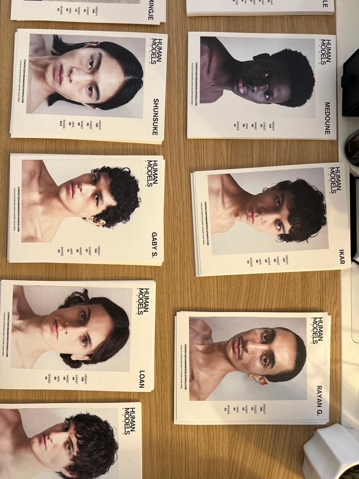 Model composite cards displayed on desk in Paris
