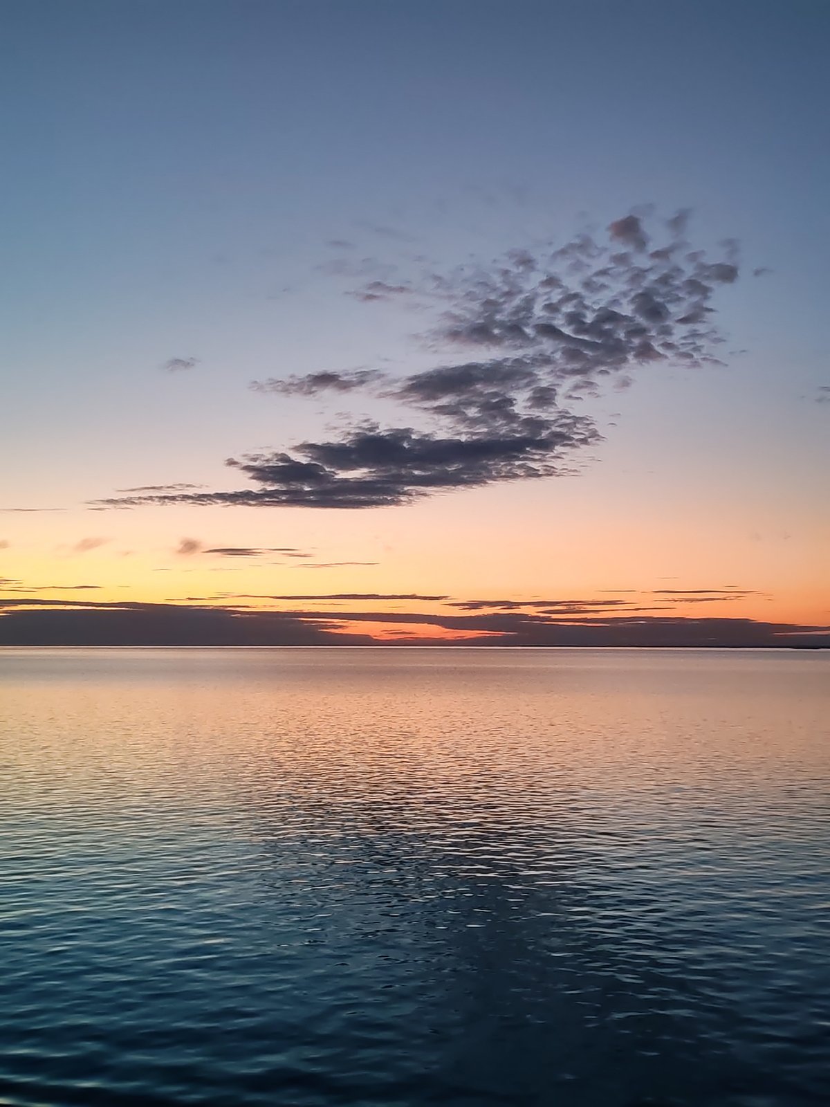 Twilight waterscape captured in sequential images across Russian lake