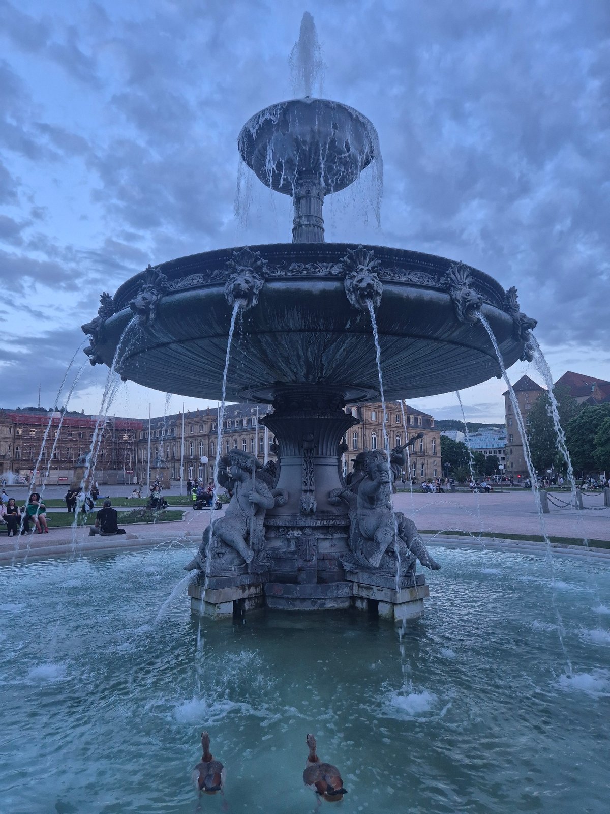 Evening fountain scenes documented across Stuttgart city squares