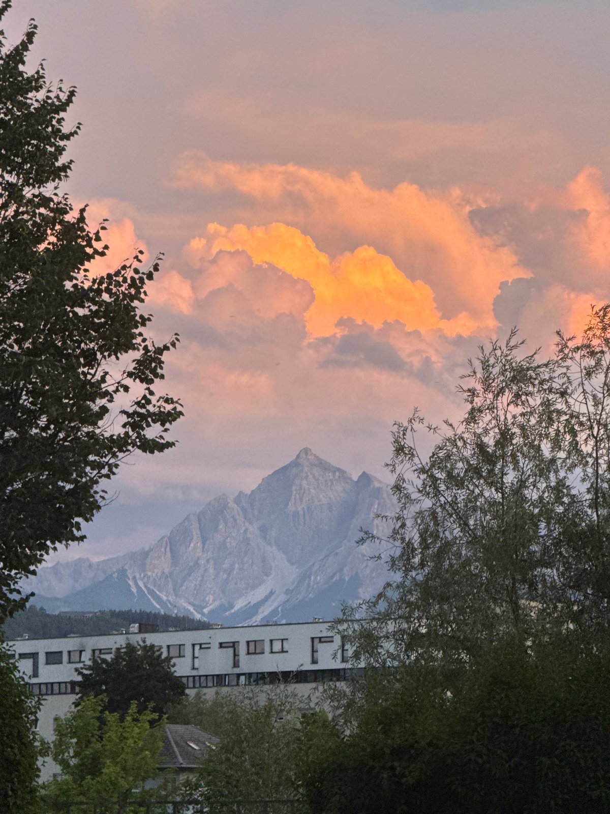 Nordkette mountains glow at sunset above Innsbruck