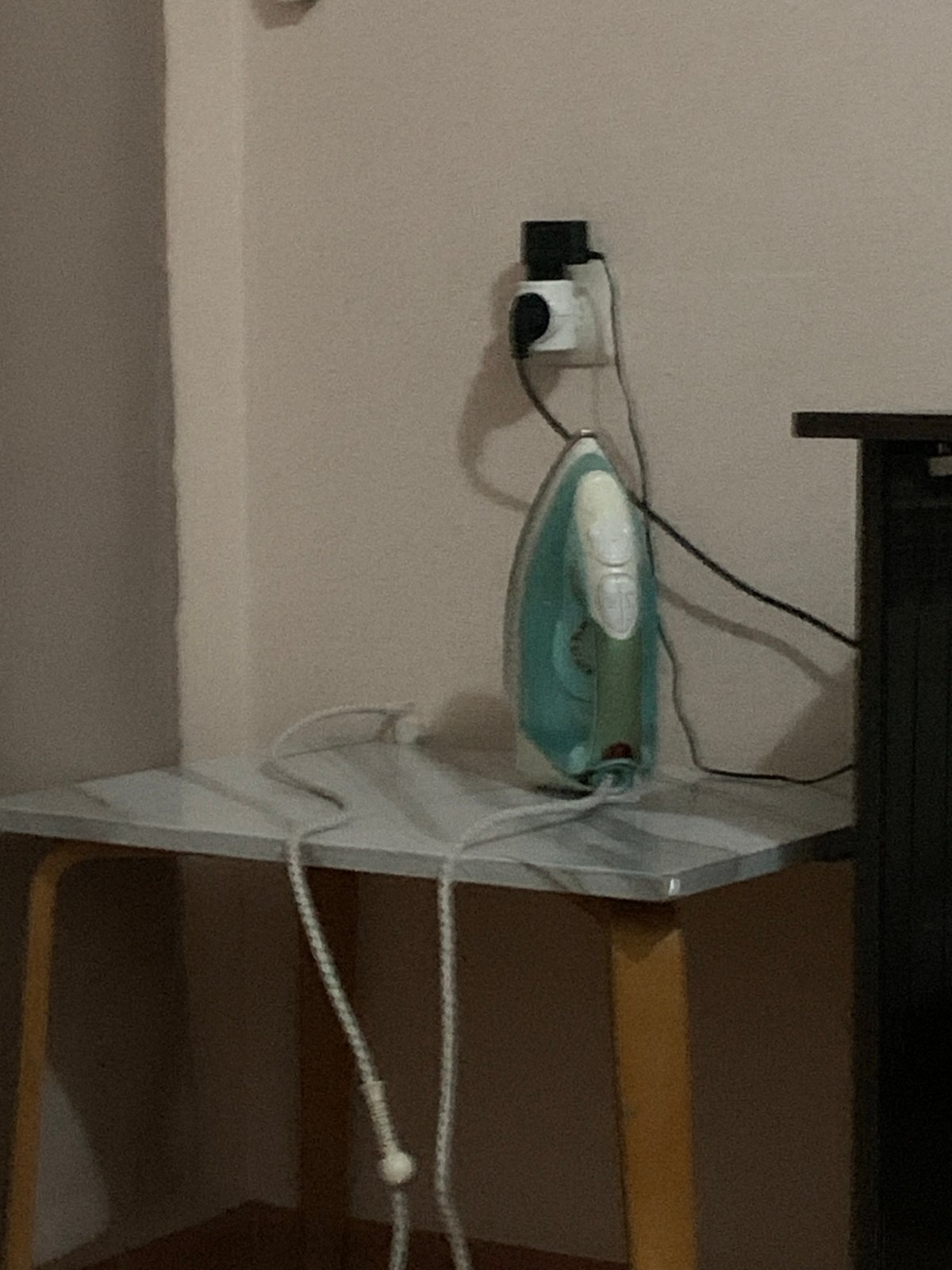 Electric iron documented in Stavropol indoor setting