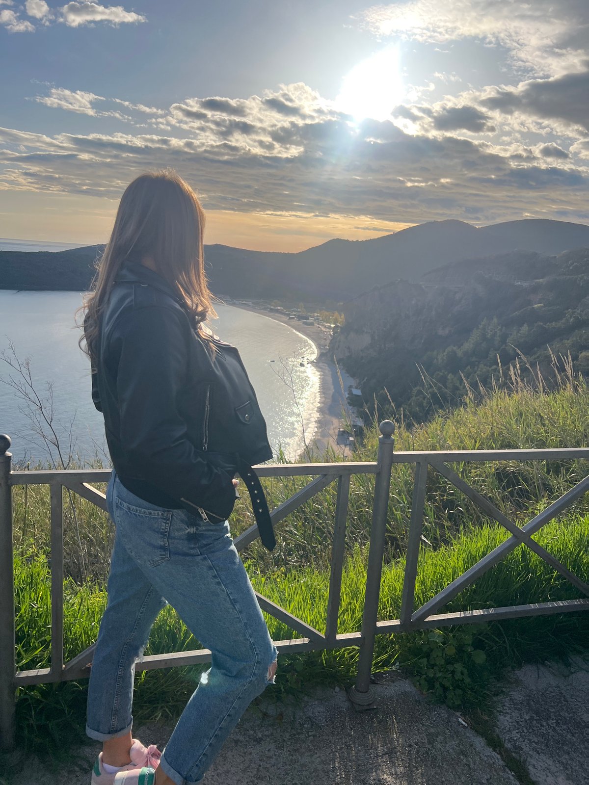Woman poses for photos at scenic Prijevor coastal overlook