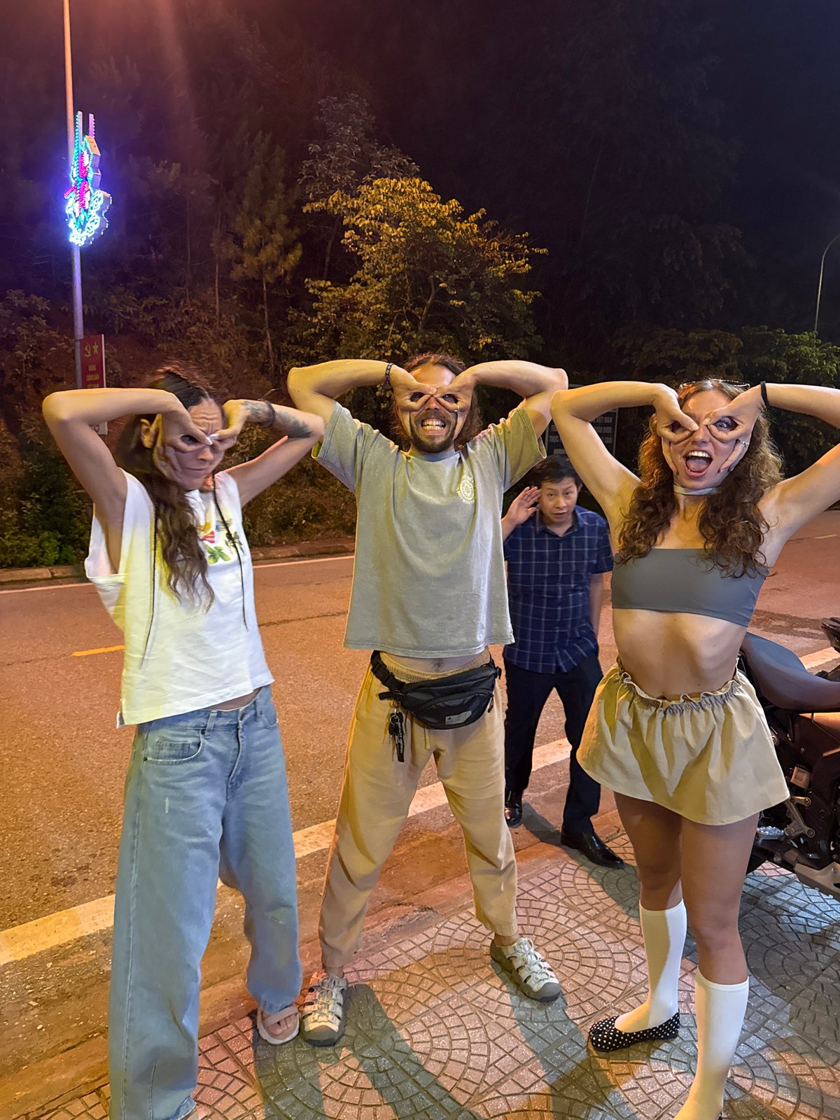 Friends socialize playfully during nighttime outing in Mù Cang Chải