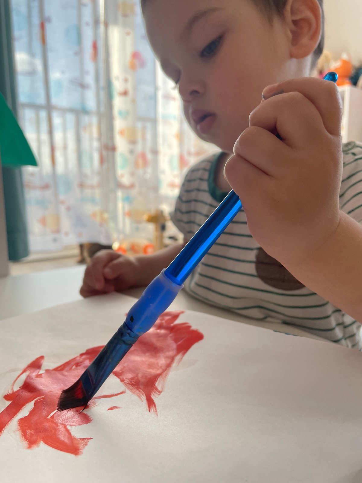 Woman in cap, child painting observed in Izhevsk