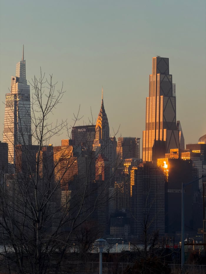 Manhattan skyline draws viewers during golden hour sunset February 28