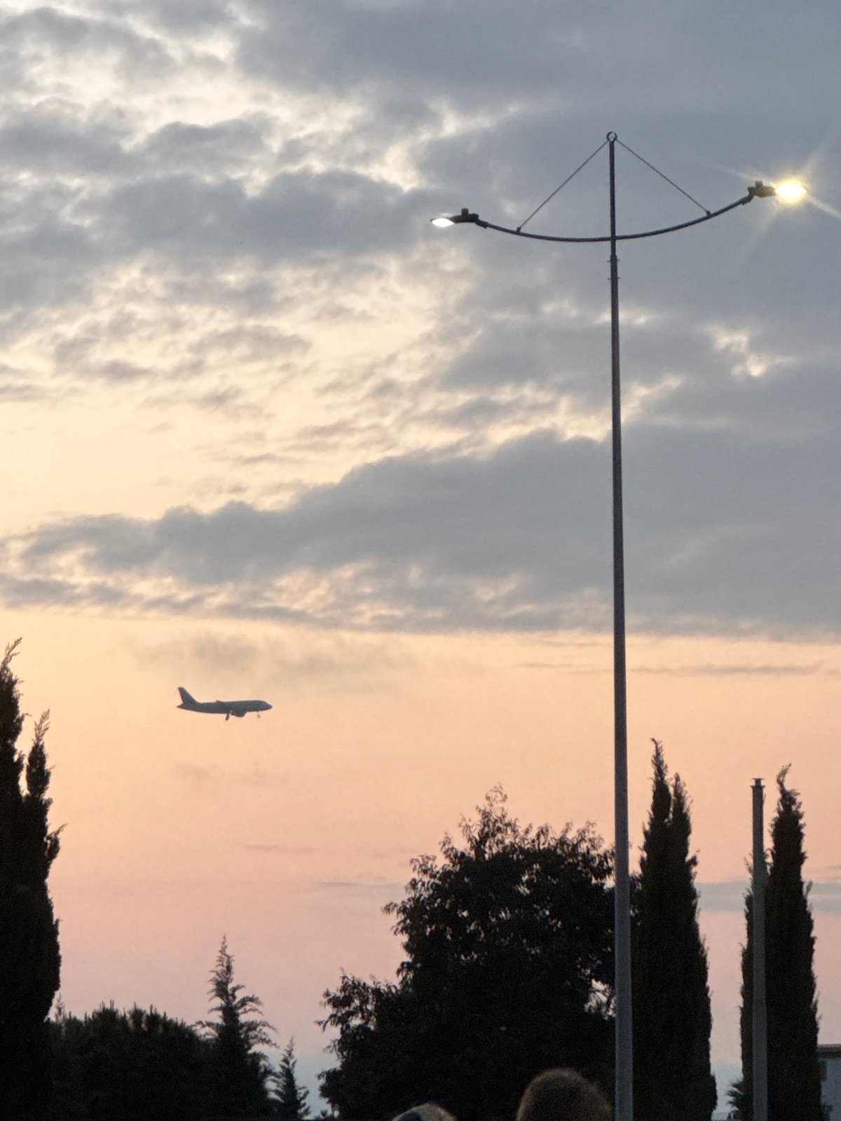 Evening scene captured in Sirius showing ascending airplane at dusk
