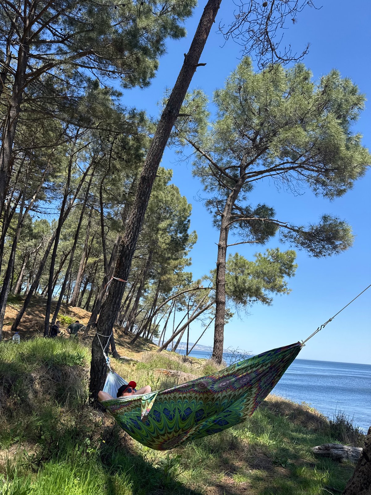 Person enjoys hammock camping by Black Sea in Varna