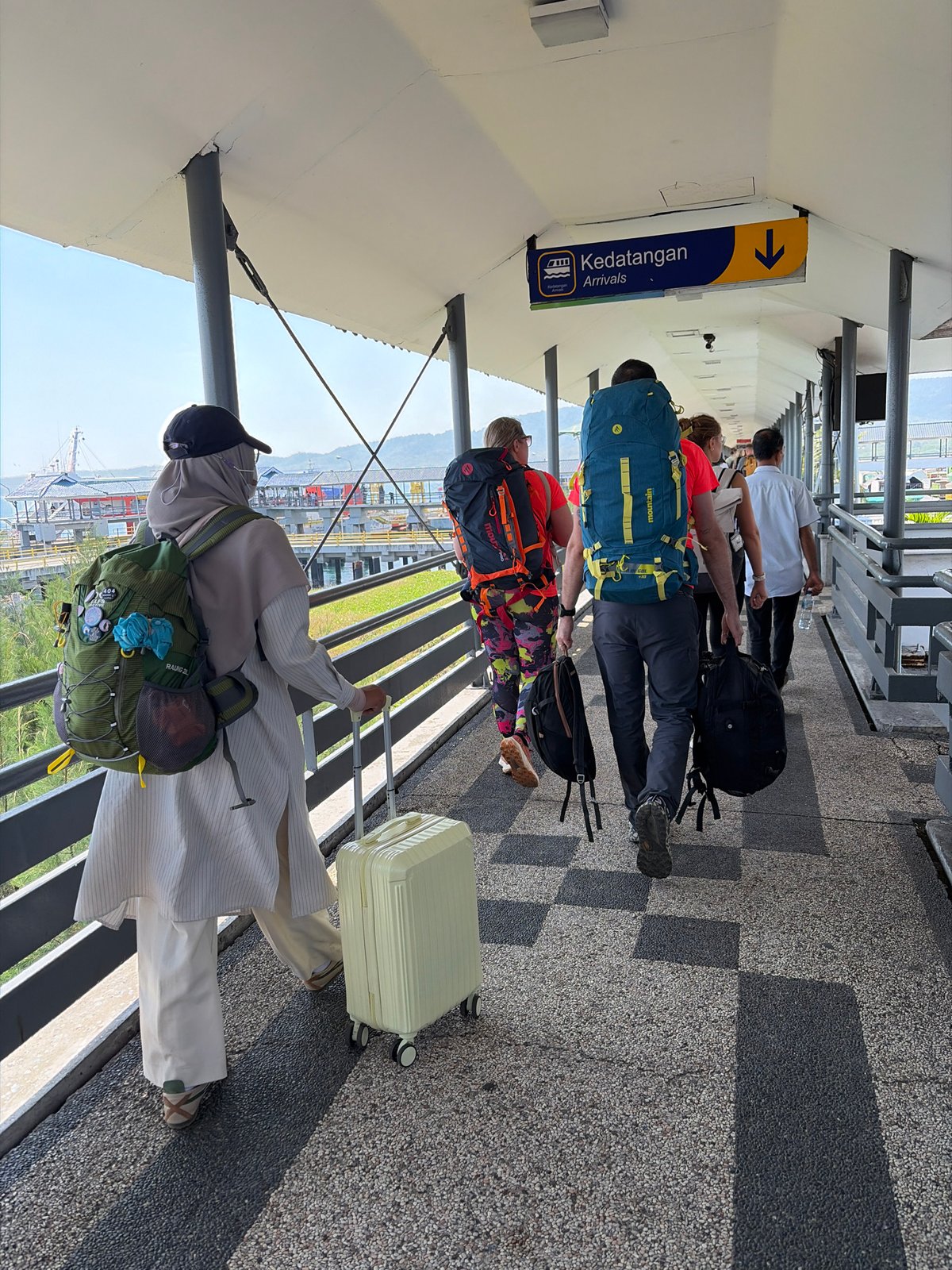 Busy ferry departure at Melaya pier, Indonesia