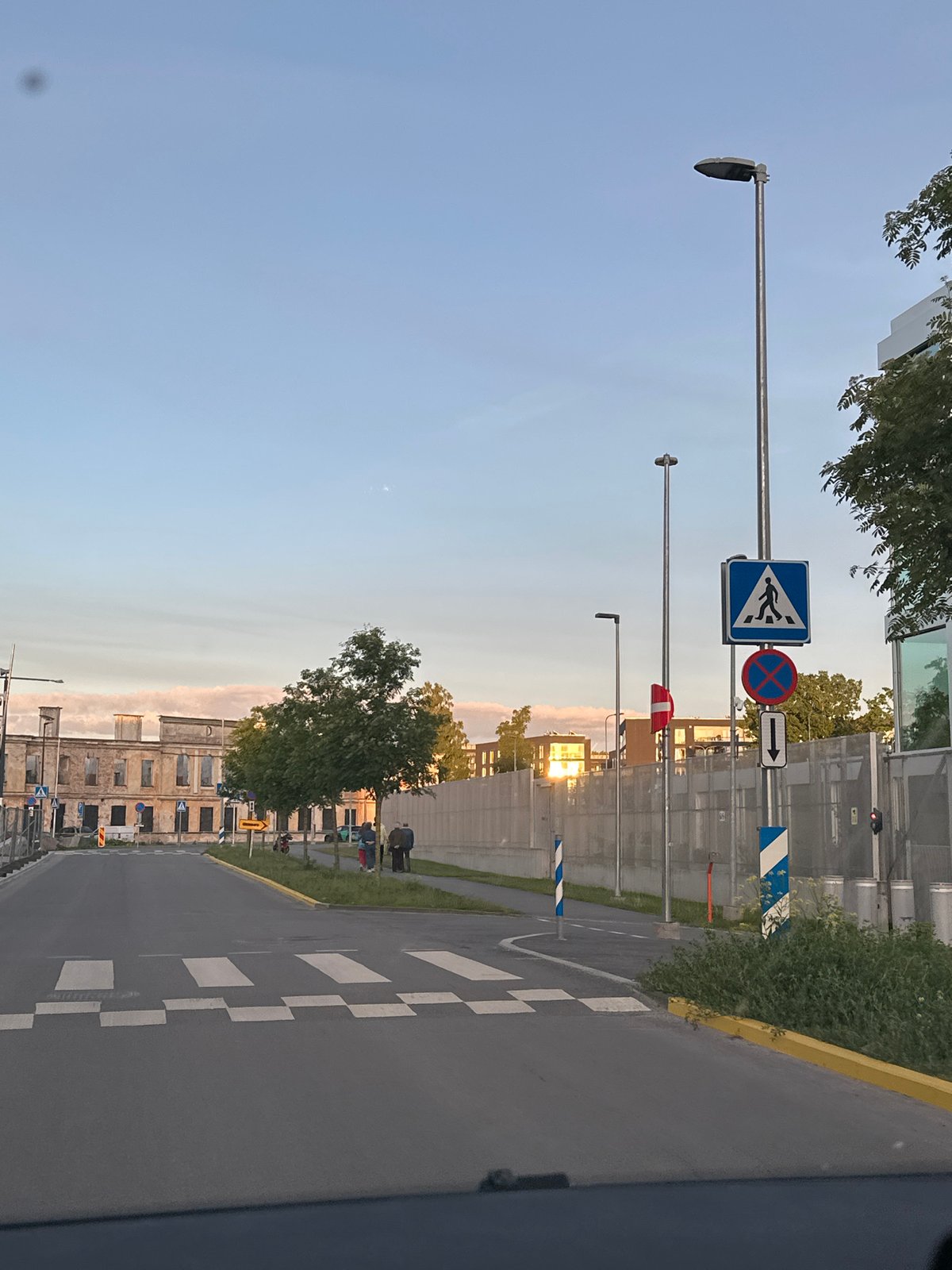 Evening stroll documented through Tallinn's harbor district at sunset