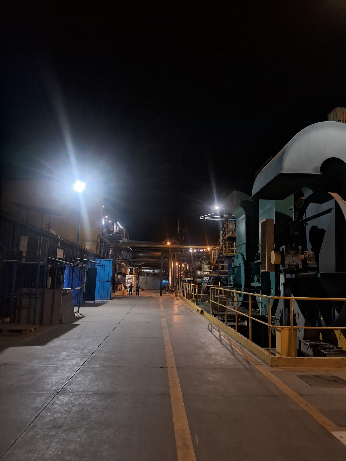 Industrial facility photographed operating at night in Chimbote, Peru