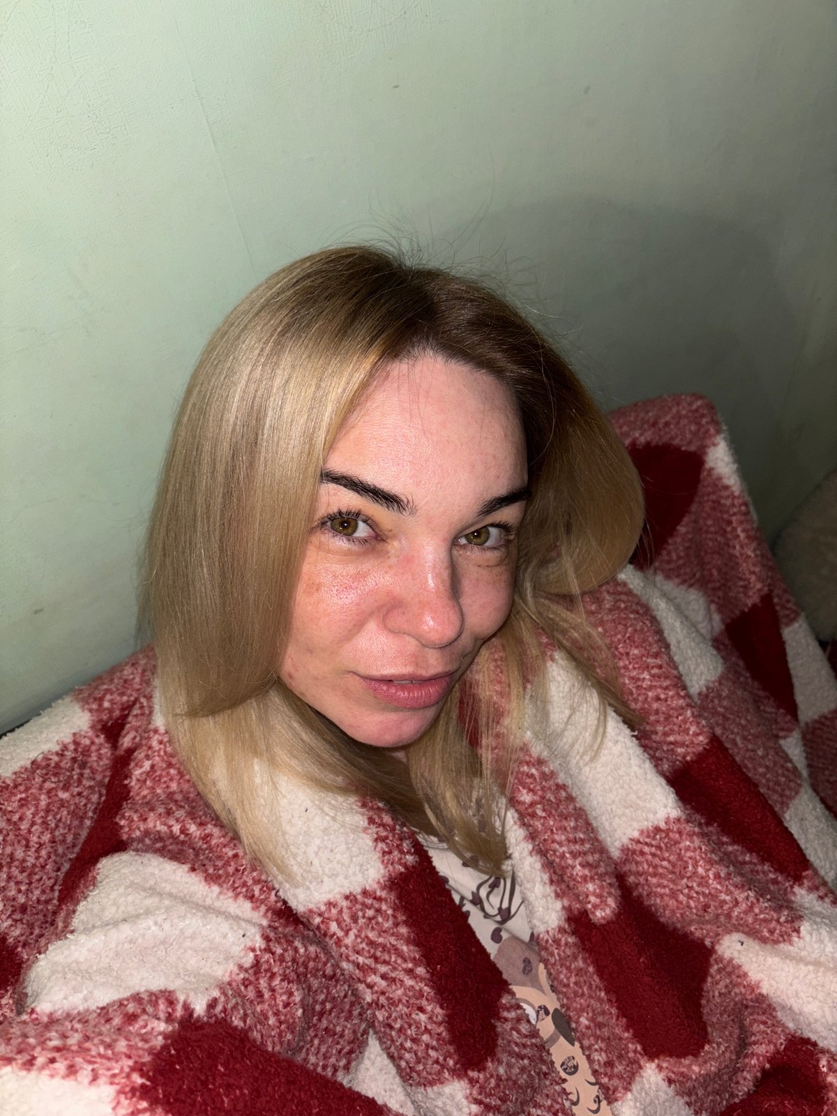 Woman photographed in casual indoor setting in Russia