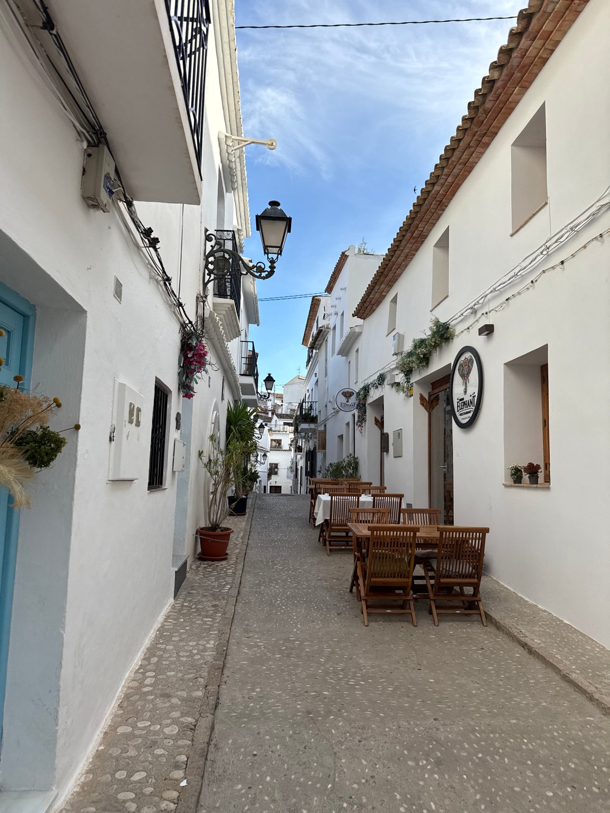 Afternoon street life documented in historic Altea, Spain