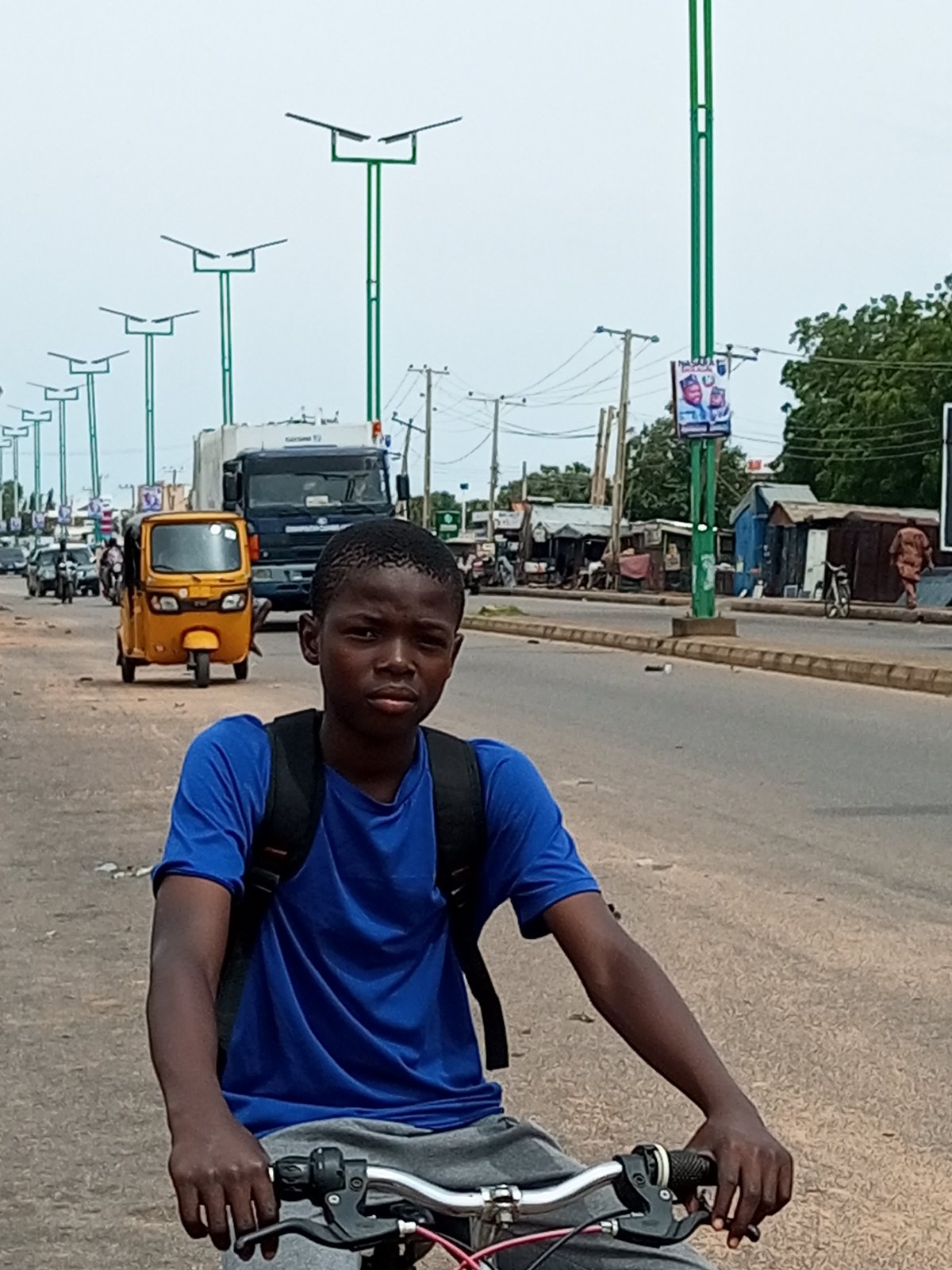 Street life and motorcycle traffic on a Garko road