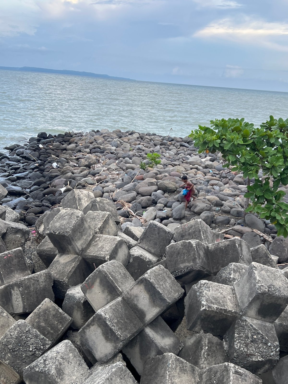 Children play along Davao City seawall during morning hours