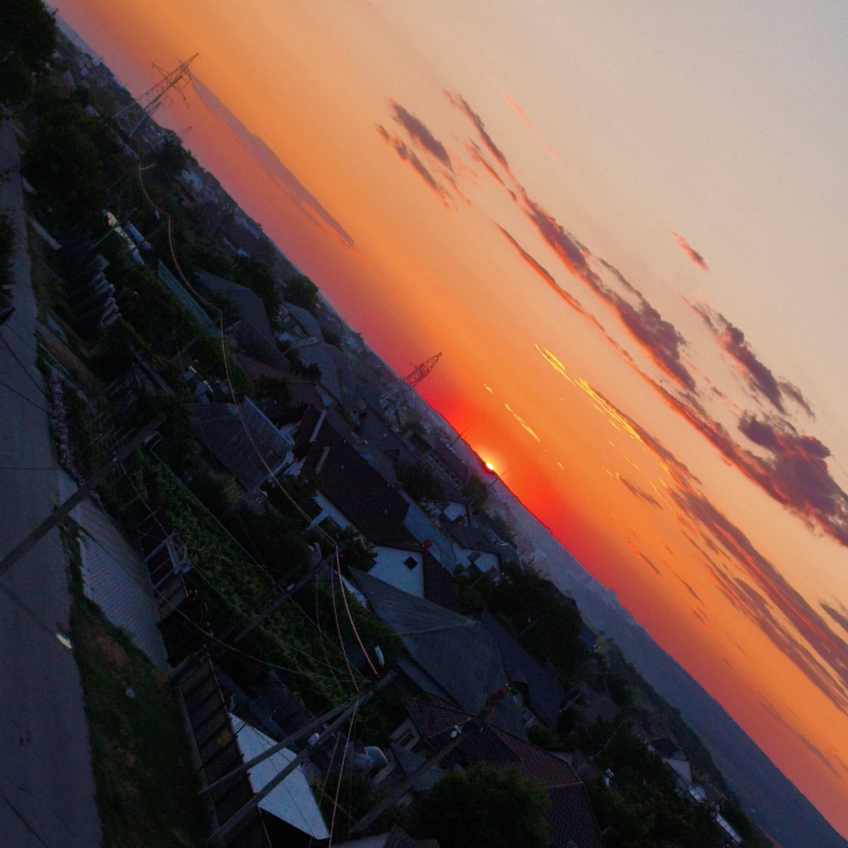 City sunset from multiple angles, sky ablaze with orange and red