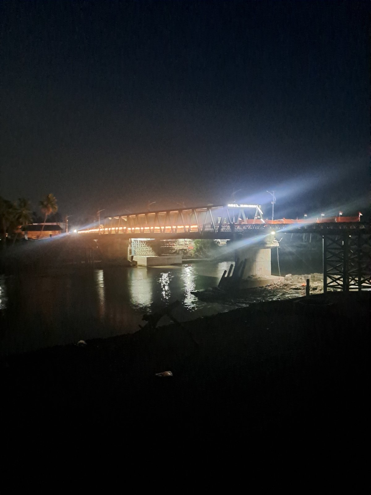 Illuminated bridge observed at night in Tingkeummanyang, Indonesia