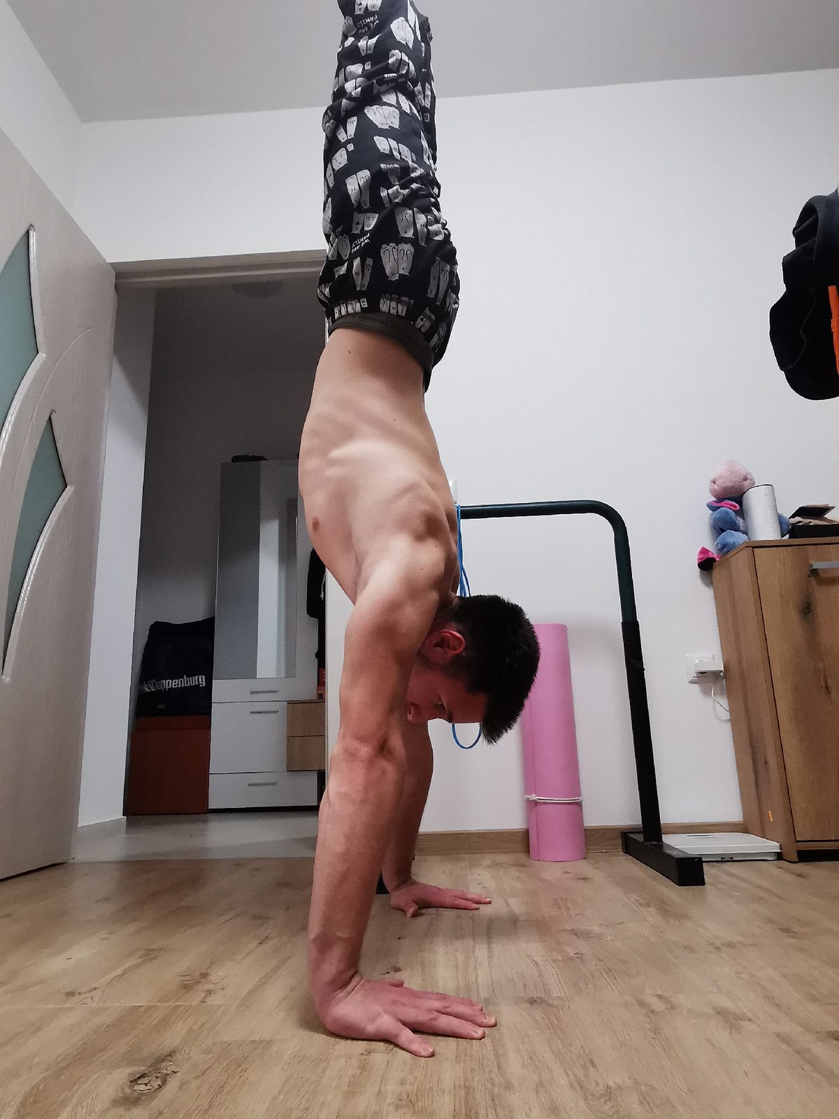 Man practices handstands and headstands in Burgas home