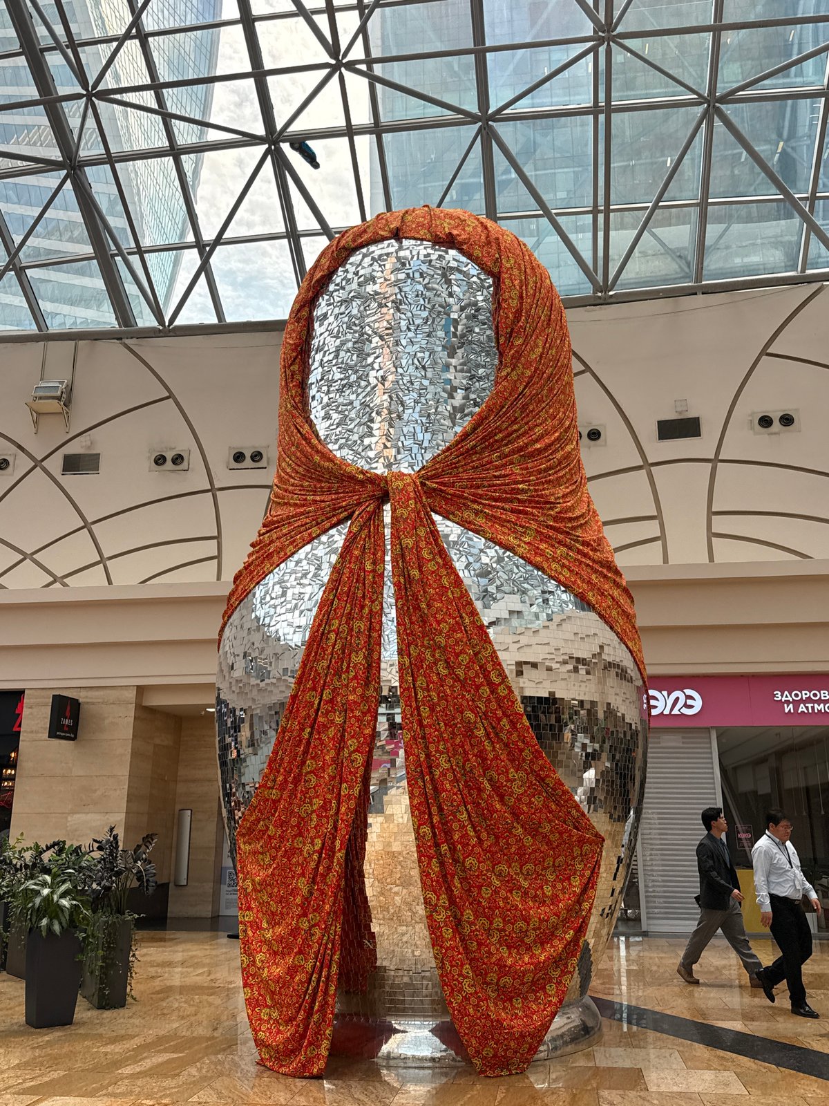Mirrored sculpture draped in fabric inside Khimki's Metropolis mall