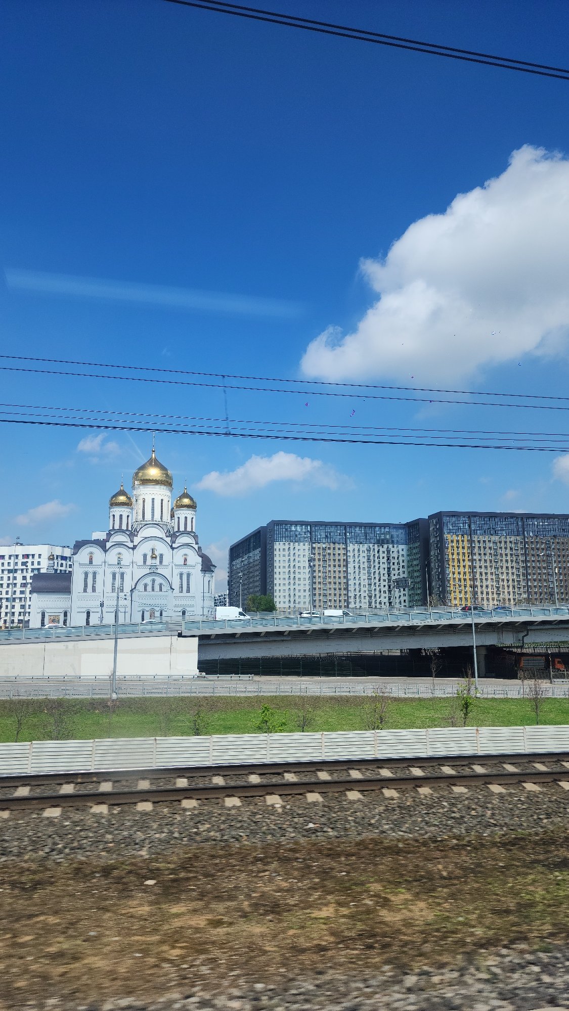 Orthodox church and covered walkway documented in urban setting