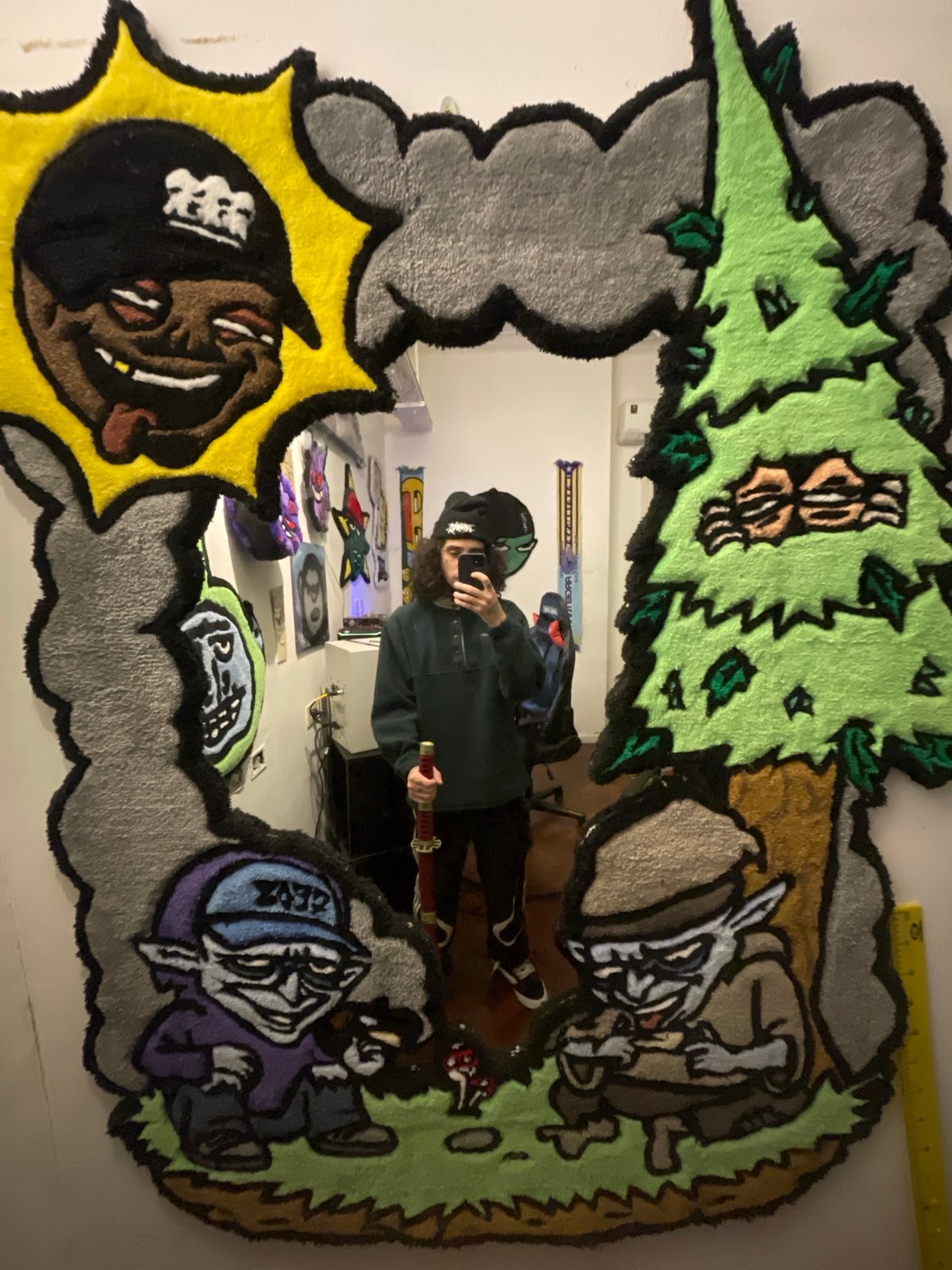 Young man takes mirror selfie in Buenos Aires studio