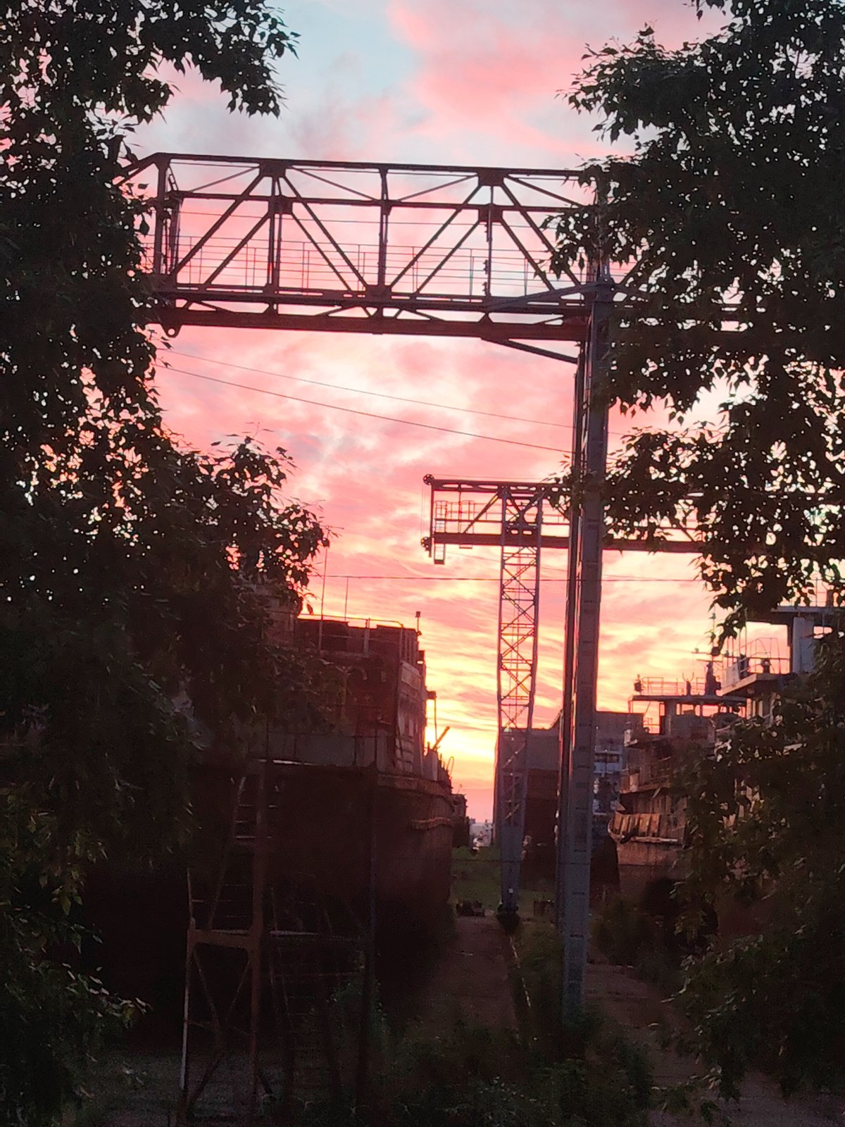 Dramatic sunset illuminates Chaikovsky industrial landscape