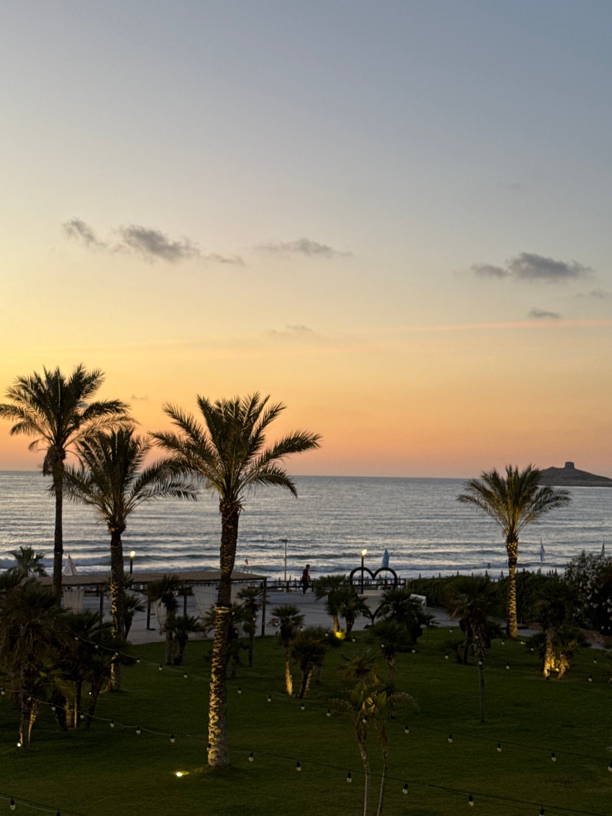Family evening at Italian seaside resort captured in twilight