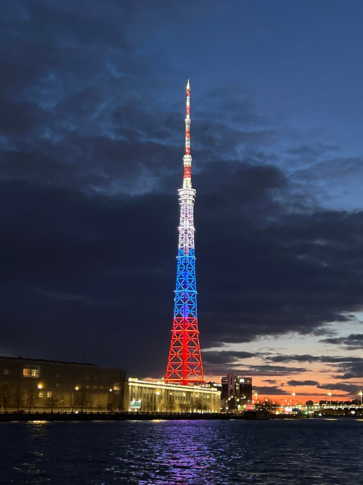 Saint Petersburg TV Tower illuminated in patriotic colors at dusk