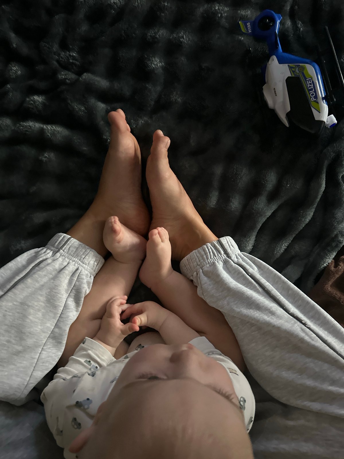 Adult and baby play indoors in Fredenbeck