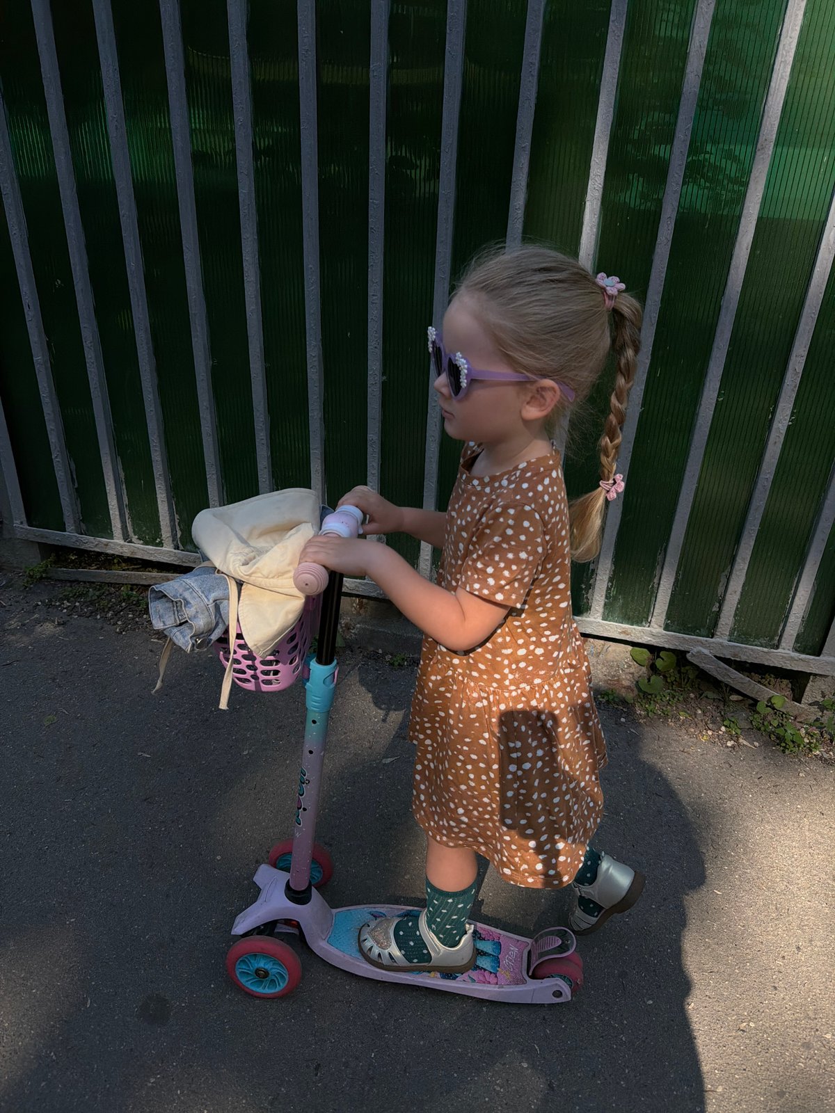 Girl rides scooter in early morning Moscow