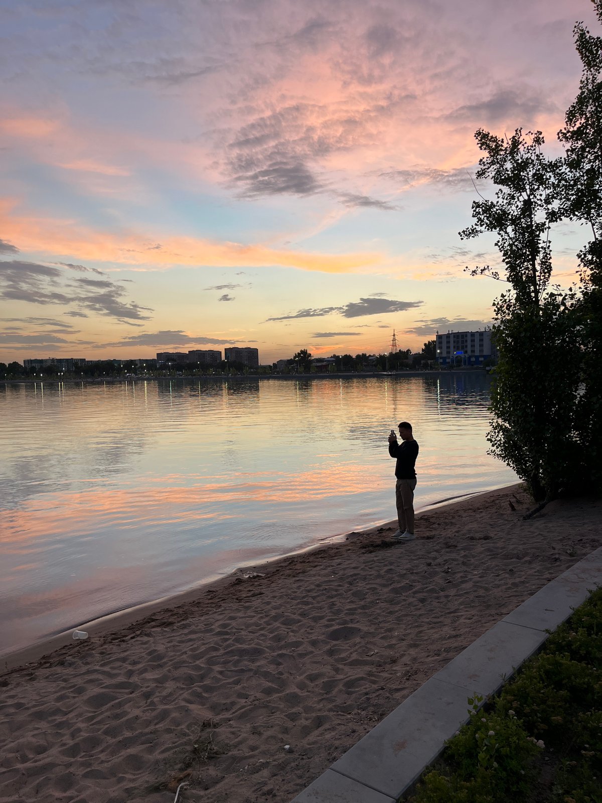 Evening leisure activities captured at Almaty's Sayran Lake waterfront