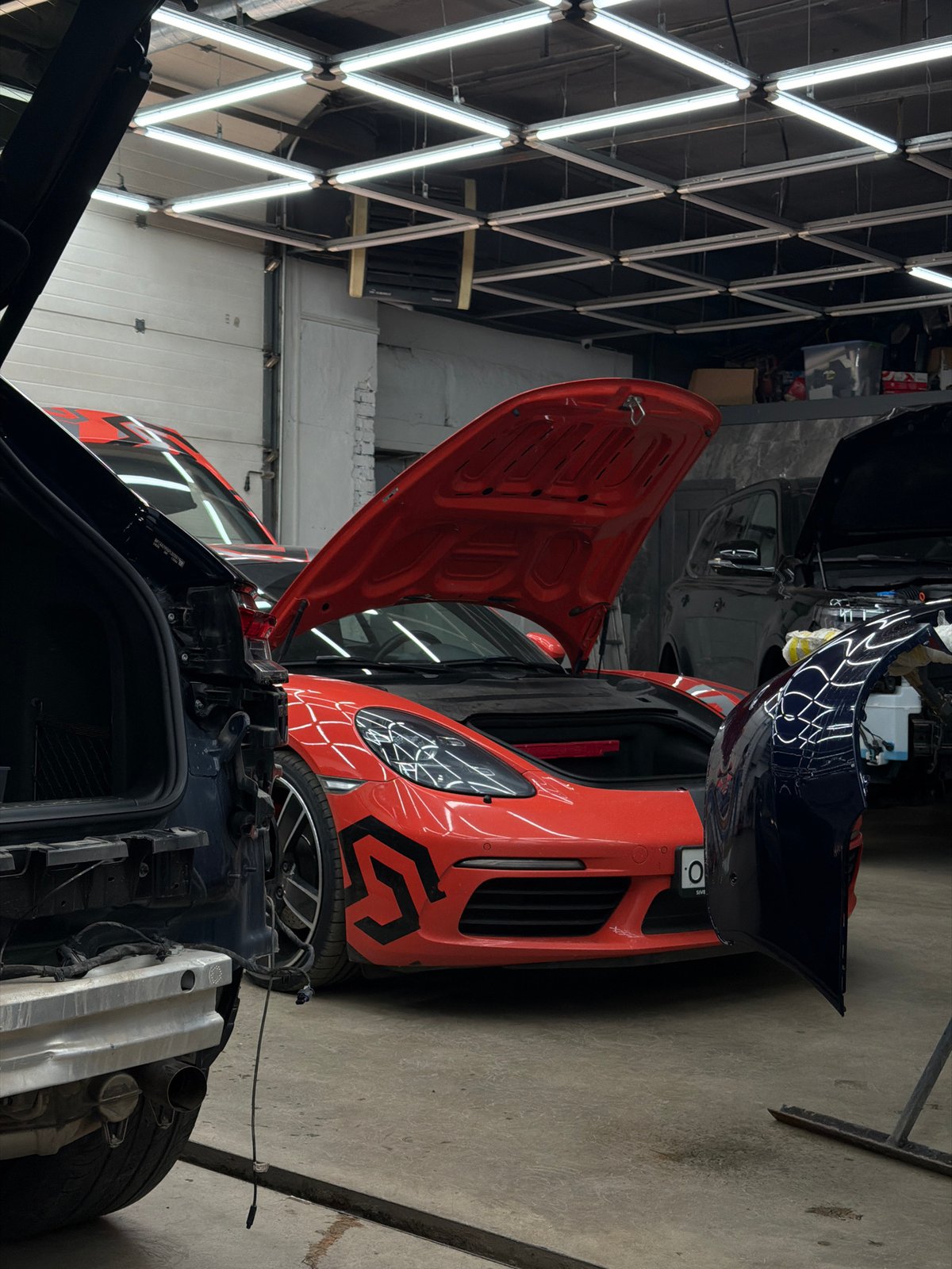 Porsche Macan getting detailed at a Krasnoyarsk auto shop