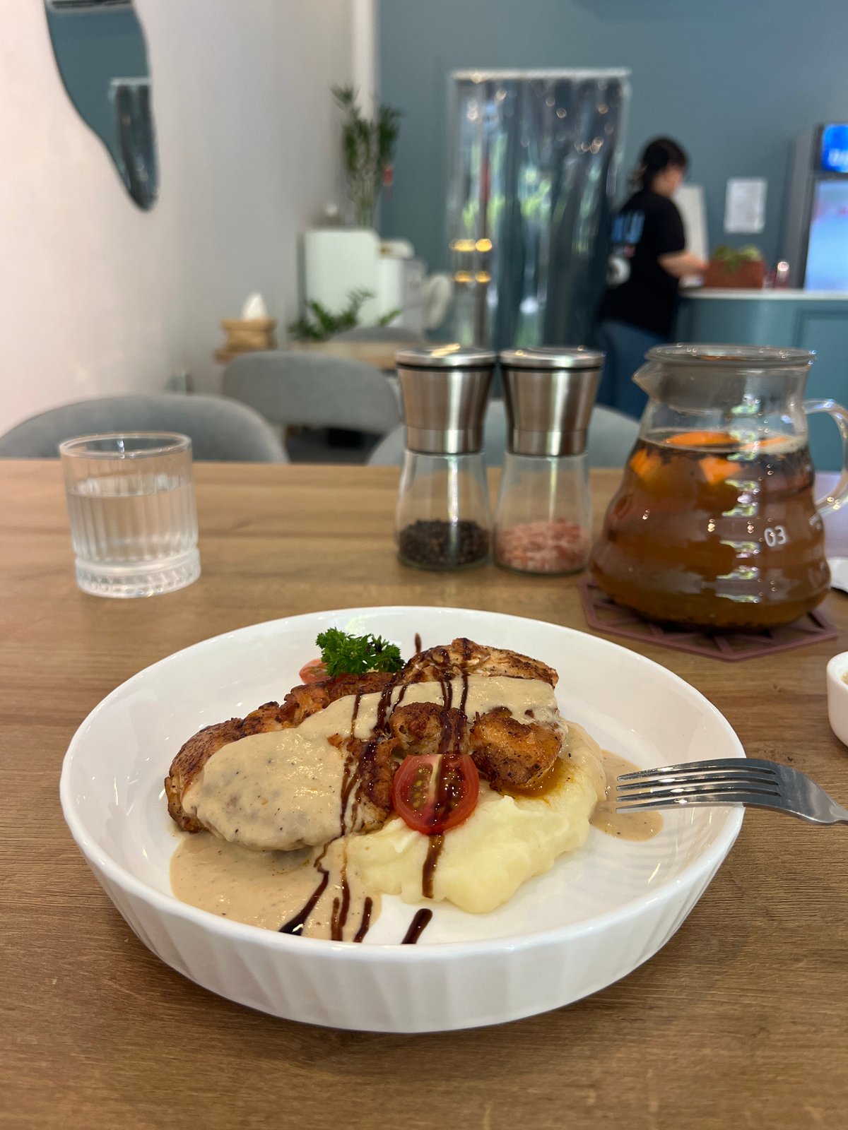 Person enjoys chicken and mashed potato meal Sunday morning