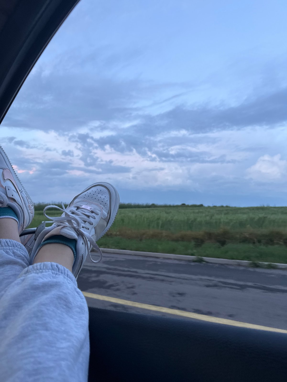 Feet Out Car Window During Evening Drive Through Burgas