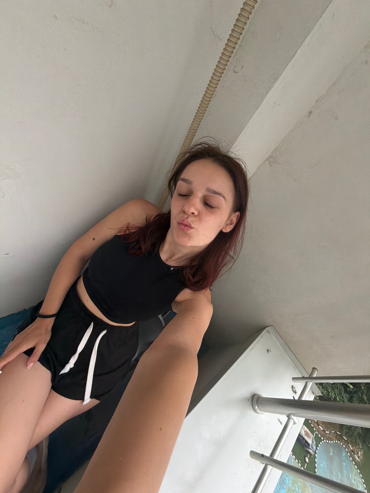 Quick selfie session on a Sofia balcony, summer afternoon.