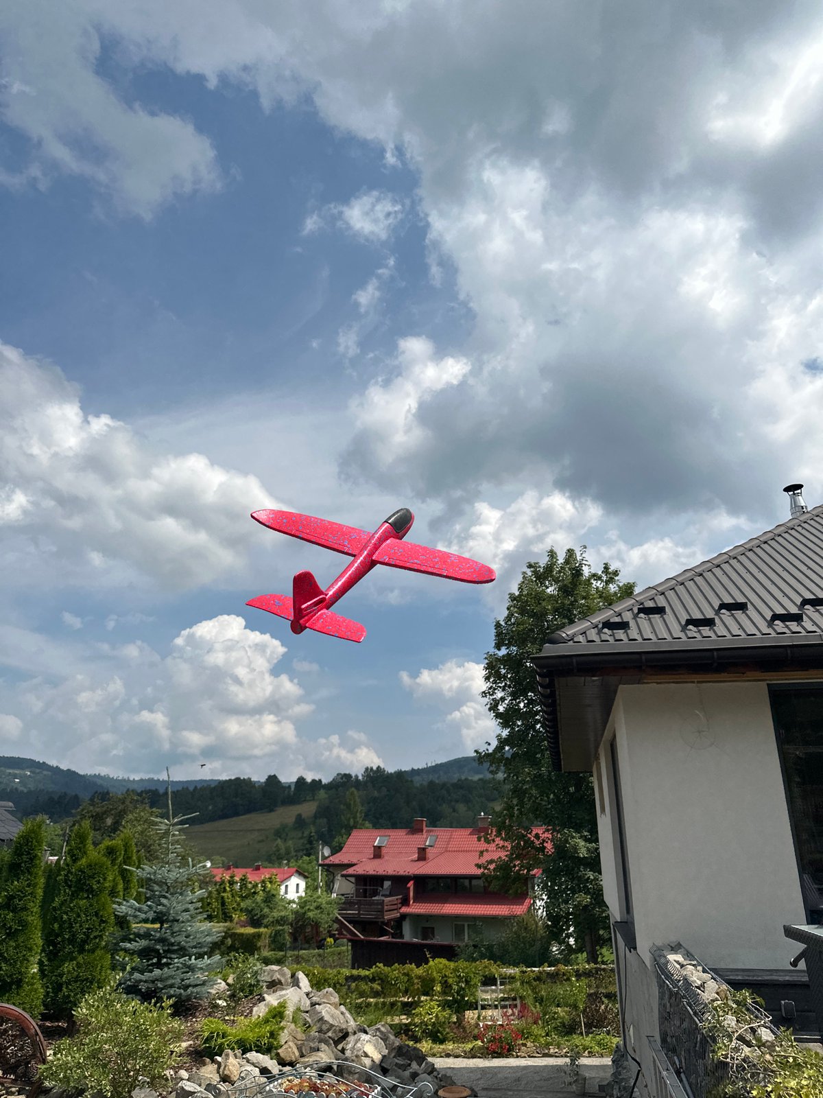 Outdoor play morning in Wisła with a toy airplane and tricycle