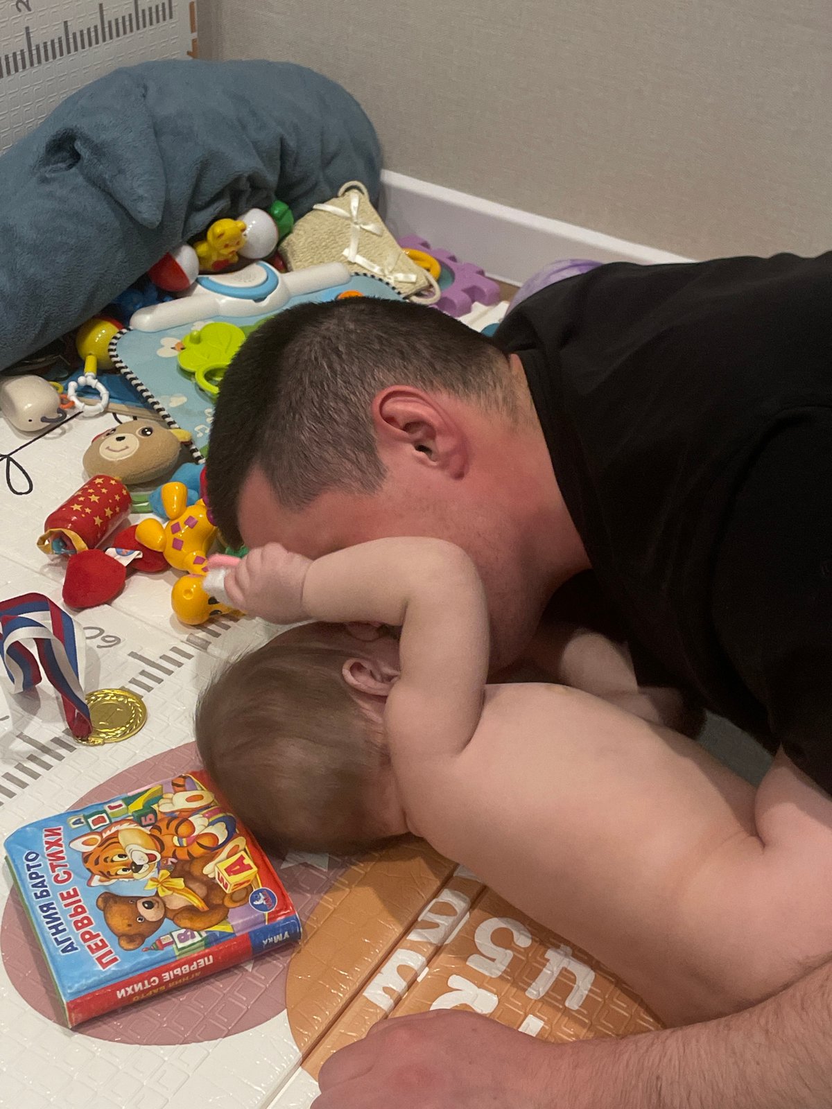 Father and baby share playtime in Подшивалово, Russia