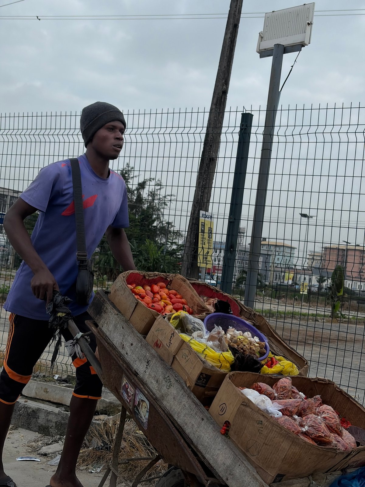 Street vendors moving goods through Igboefon neighborhood