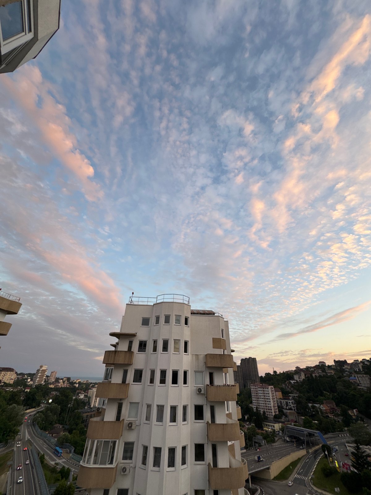 Sochi cityscape: highways, apartment towers, and green hillsides