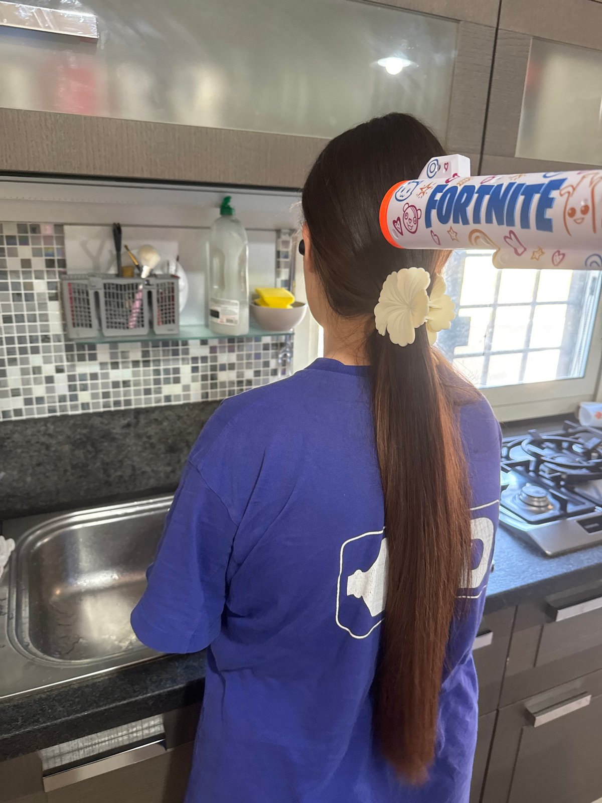 Person spotted in Rome wearing Fortnite toy in hair