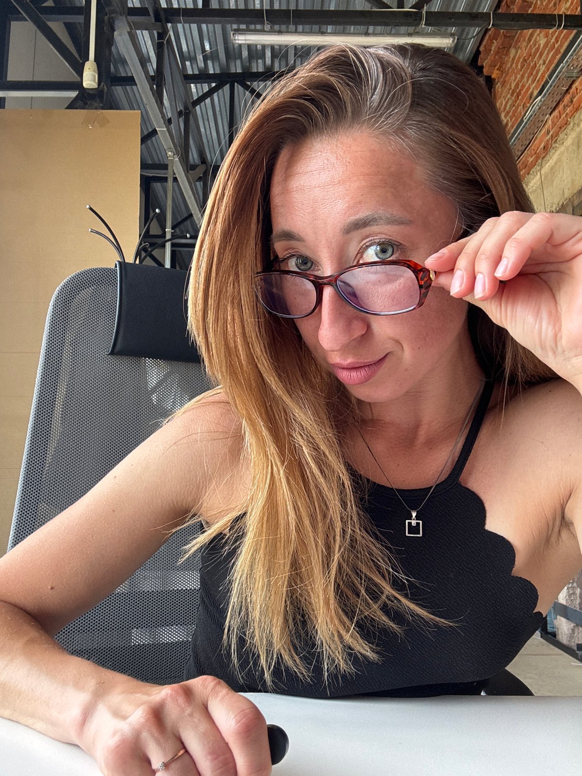 Woman documents eyewear moments in Chaikovsky office setting