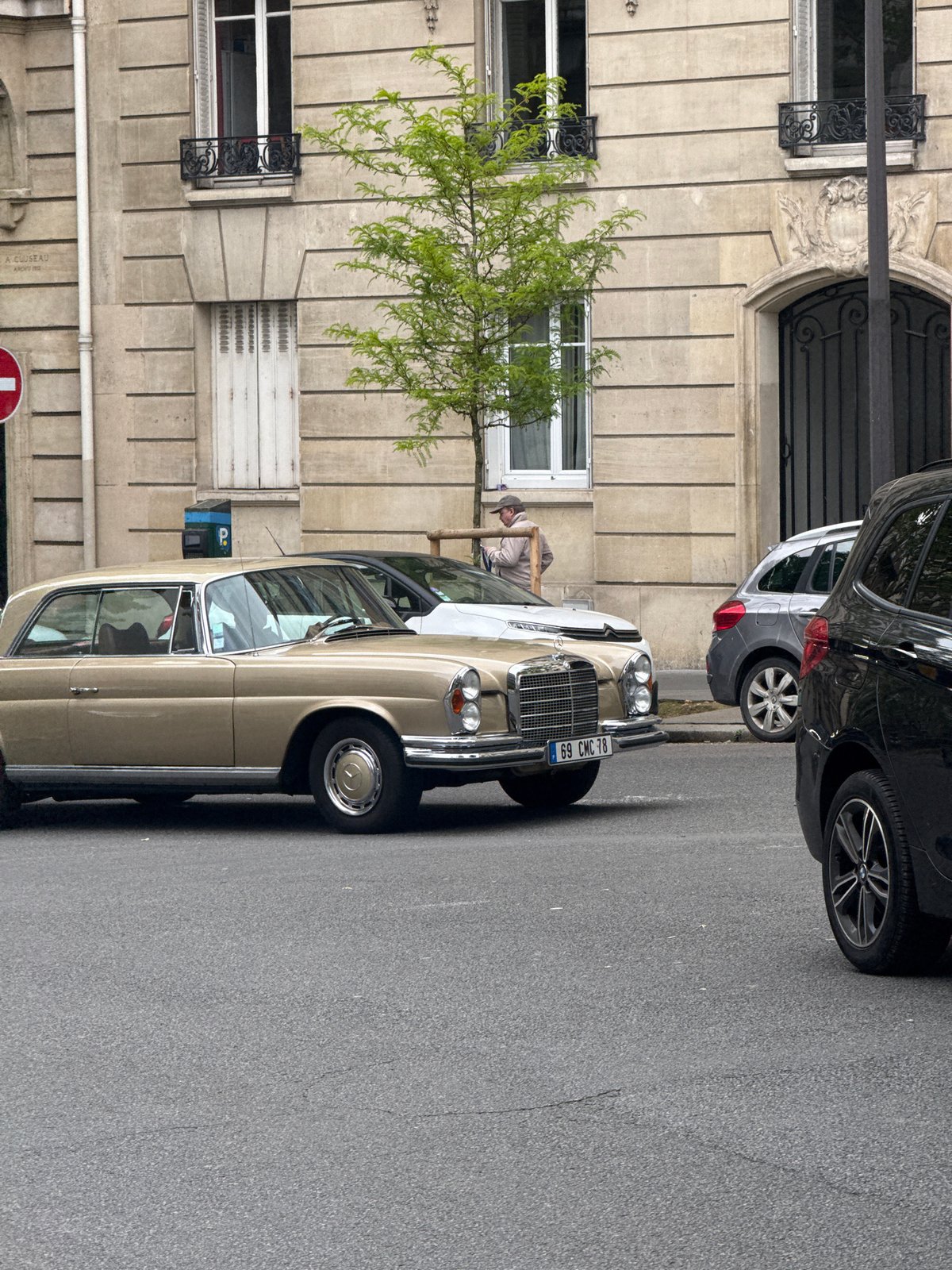 Woman spotted on Paris street near vintage Mercedes-Benz