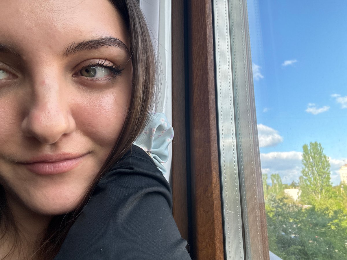 Woman spends quiet afternoon reading and taking selfies in Sofia