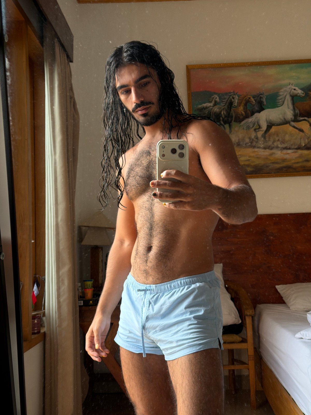 Post-swim mirror selfie in a North Kuta hotel room