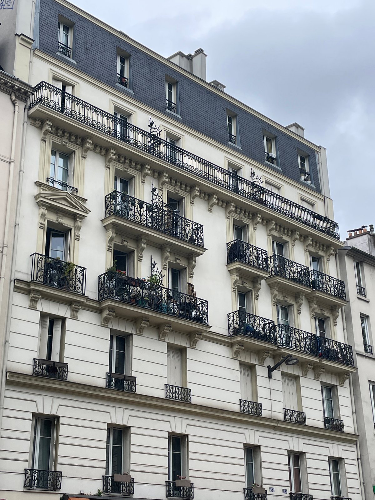 Ordinary morning life documented on classic Parisian street