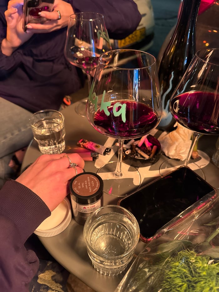 Friends enjoy wine and street photography session in Tel Aviv