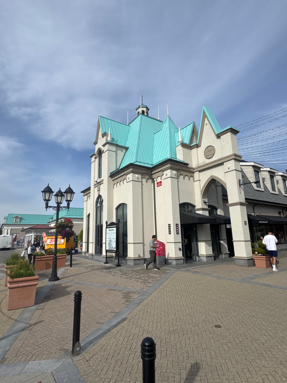 Visitor documents stroll through Richmond designer outlet mall